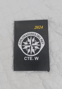 a black book that says exploradores del rey cte.w.