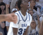 a uae basketball player with the number 3 on his shirt