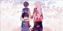 a girl with horns is holding hands with a boy and girl