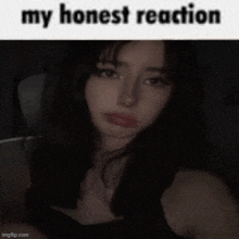 a girl in a black tank top is sitting in a car with a caption that says `` my honest reaction '' .