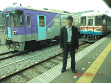 a man standing in front of a train with the date 13/06/2009 on the bottom