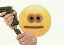 a person is holding a gun in front of a yellow smiley face with a sad face .