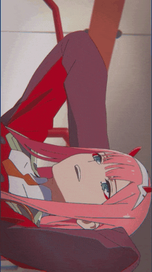 a girl with pink hair and blue eyes laying down