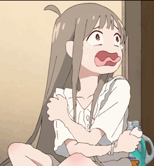 a cartoon girl is sitting next to a laundry detergent