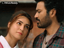 a man and a woman are looking at each other with a 7wick reddy logo above them