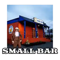 a man in a suit stands in front of small bar