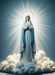 a statue of mary is surrounded by clouds and rays of light