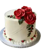 a white cake with red roses on it