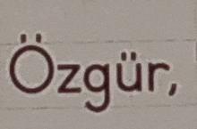 a close up of the word ozgur on a piece of paper