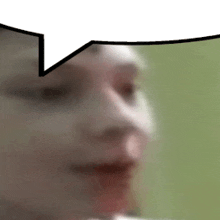 a close up of a person 's face with a speech bubble above it