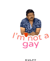 a man is sitting at a table with the words " i 'm not a gay " written above him