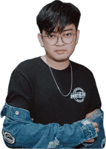 a young man wearing glasses and a black shirt with the word death on it