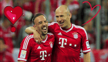 two men in red t-mobile jerseys are hugging