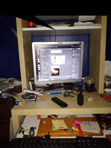 a messy desk with a computer monitor that says ' skype ' on it