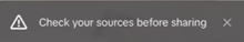 a check your sources before sharing message is displayed on a computer screen