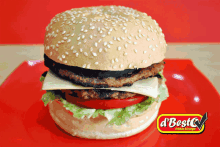 a hamburger with cheese lettuce and tomato on a red plate that says d ' best cream burger