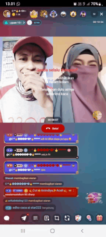 a phone screen shows a man and a woman on a live stream