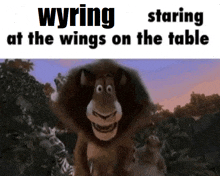 a cartoon of a lion with the words staring at the wings on the table below it