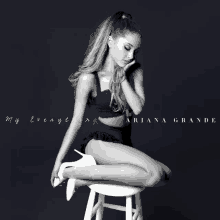 ariana grande is sitting on a stool on the cover of her album my everything