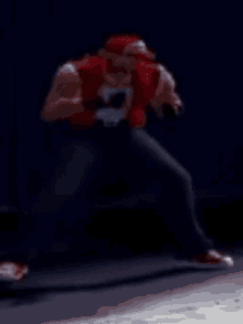 a blurred image of a video game character in a red vest and hat