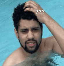 a man with a beard is scratching his head in a pool with a question mark on his head