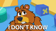 a cartoon bear says i don 't know in front of a blue box