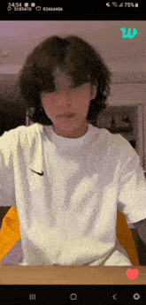 a screen shot of a person wearing a white nike t shirt