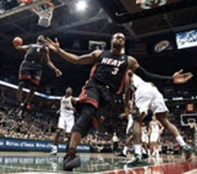 a basketball player wearing a jersey that says heat on it