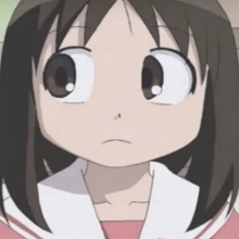 a close up of a cartoon character 's face with a pink shirt on