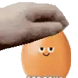 a hand is holding an egg with a smiling face on it .