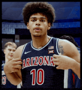 a basketball player wearing a blue jersey with the number 10 on it