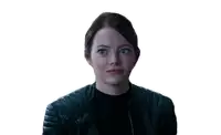 a woman is wearing a black leather jacket and making a face