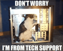 a cat sitting inside of a computer case with the words " don t worry i 'm from tech support "