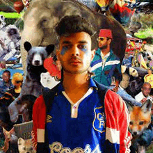 a man in a blue and red shirt is standing in front of a collage of animals and people .