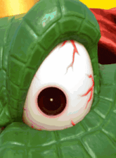 a close up of a turtle 's eye with a red eyeball