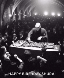 a black and white photo of a dj with the words happy birthday shura on the bottom