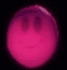 a pink circle with a smiley face on it