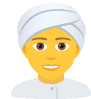 a man with a turban on his head is smiling