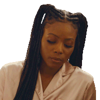 a woman with braids is wearing a white shirt and has her eyes closed