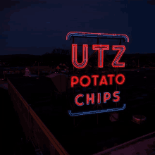 a neon sign that says utz potato chips