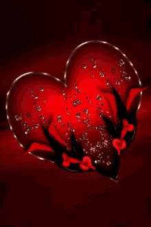 a red heart surrounded by black flowers and diamonds