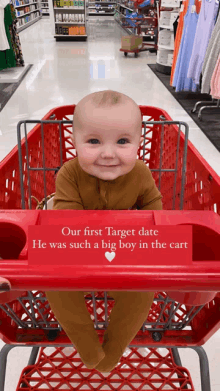 a baby is sitting in a shopping cart that says our first target date