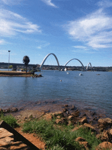 a bridge over a body of water with boats on it