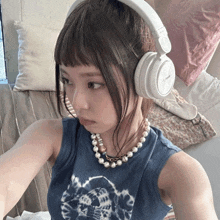 a woman wearing headphones that say sony on the top