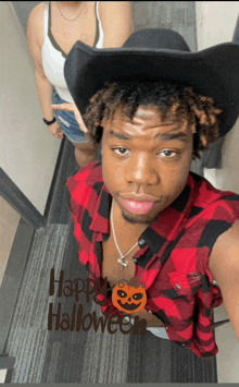 a man wearing a cowboy hat and a plaid shirt is standing in front of a sign that says " happy halloween "