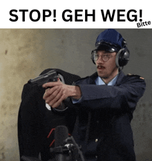 a man in a police uniform is pointing a gun with the words " stop geh weg " above him