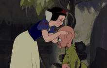 a cartoon of snow white kissing a dwarf on the cheek