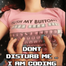 a woman wearing a shirt that says push my buttons