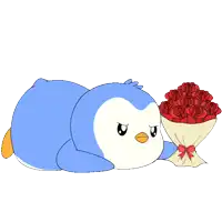 a blue and white penguin laying down next to a bouquet of red roses