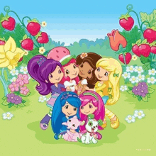 a group of strawberry shortcake dolls are posing for a picture together .